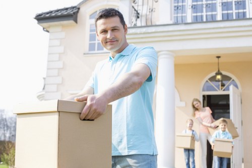 Local man and van removals team handling household items in Wallington