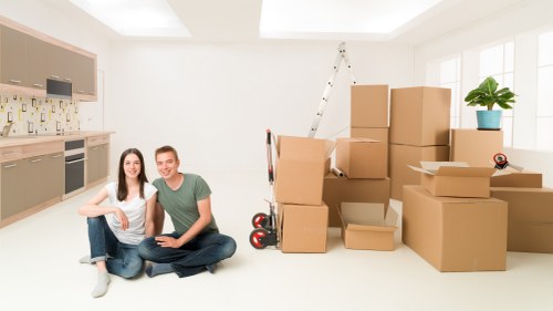 Loading household items into a van for a Wallington relocation