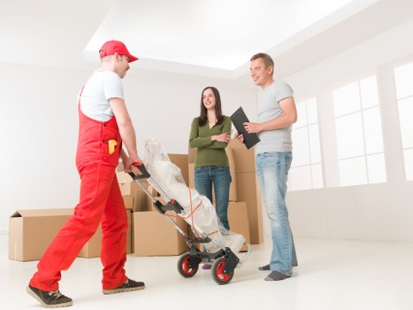 Professional Wallington man with a van preparing items for secure delivery