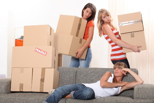 Furniture and boxes being carried during a Wallington move