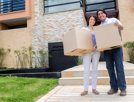 Removal van and moving team in a Wallington residential street