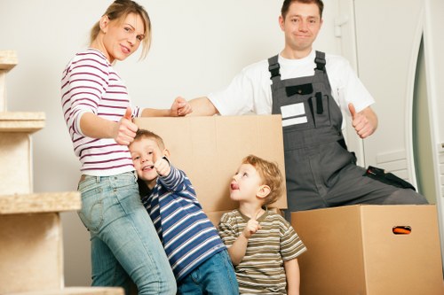 Sorting cardboard and household items for recycling during a Wallington move